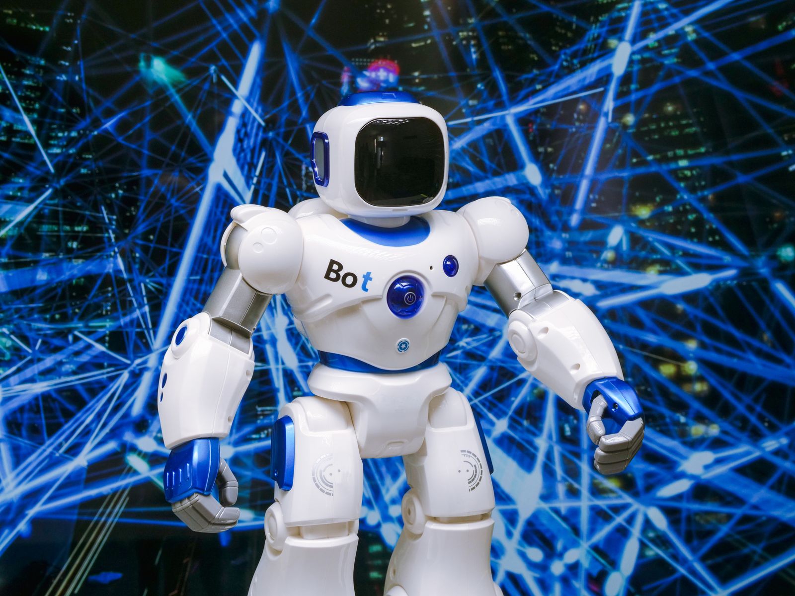 Humanoid robot with glowing blue accents in a digital network