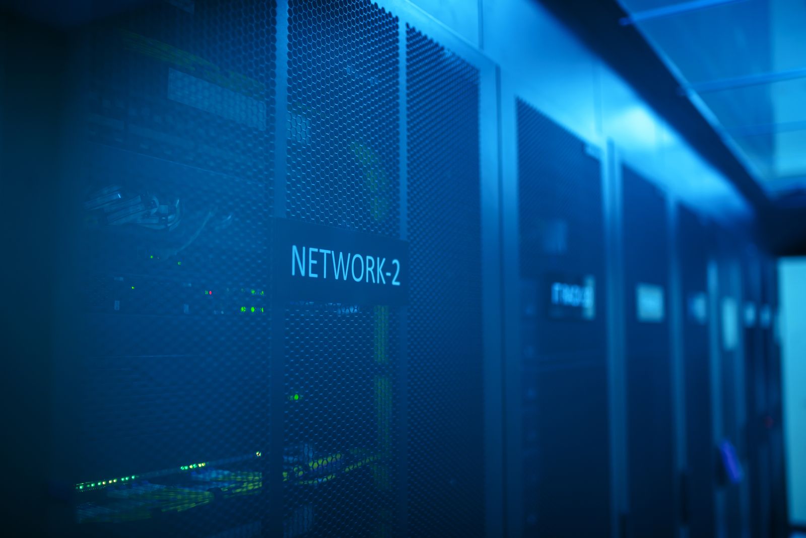 Modern server room with network equipment and blue lighting
