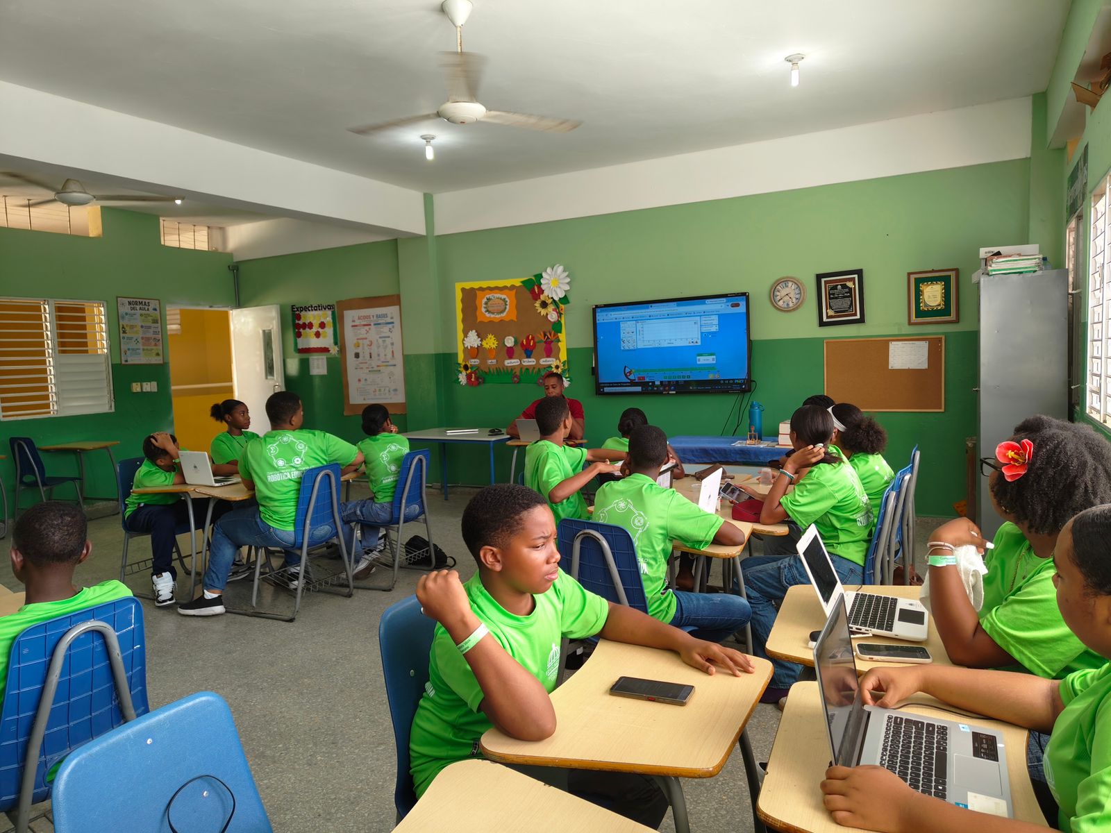 Primary school children in uniform at their desks